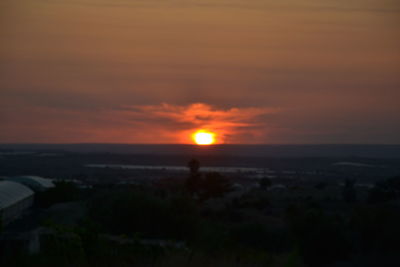 Scenic view of sea against romantic sky at sunset