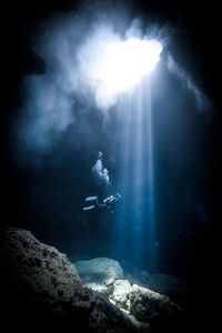 Scenic view of scuba diver in sea