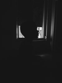 Woman in dark room