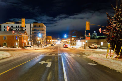 Illuminated street at night