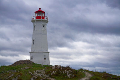 Louisbourg lighthouse in nova scotia on a stormy day