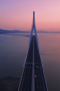 View of bridge over sea against sky during sunset