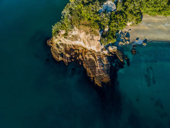 High angle view of rocks on sea