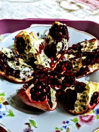 Close-up of pomegranate in plate on table