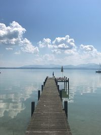 Pier over sea against sky