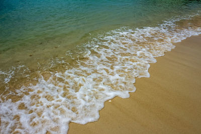 High angle view of surf on beach