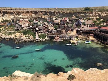 High angle view of townscape by sea