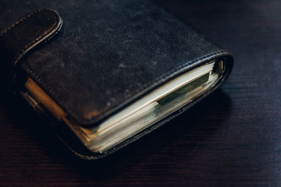 High angle view of black diary on table