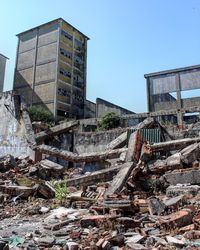 Low angle view of abandoned building against sky