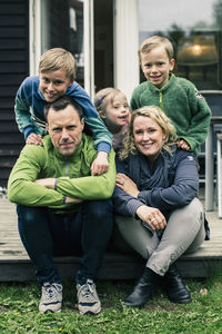 Portrait of happy family on porch