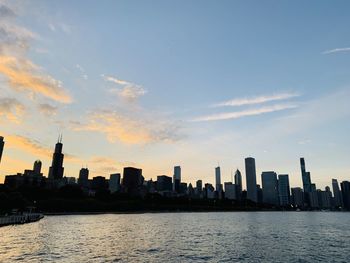 Scenic view of buildings against sky during sunset