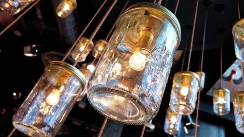 Low angle view of pendant lights hanging from ceiling