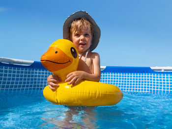 Portrait of woman swimming in pool