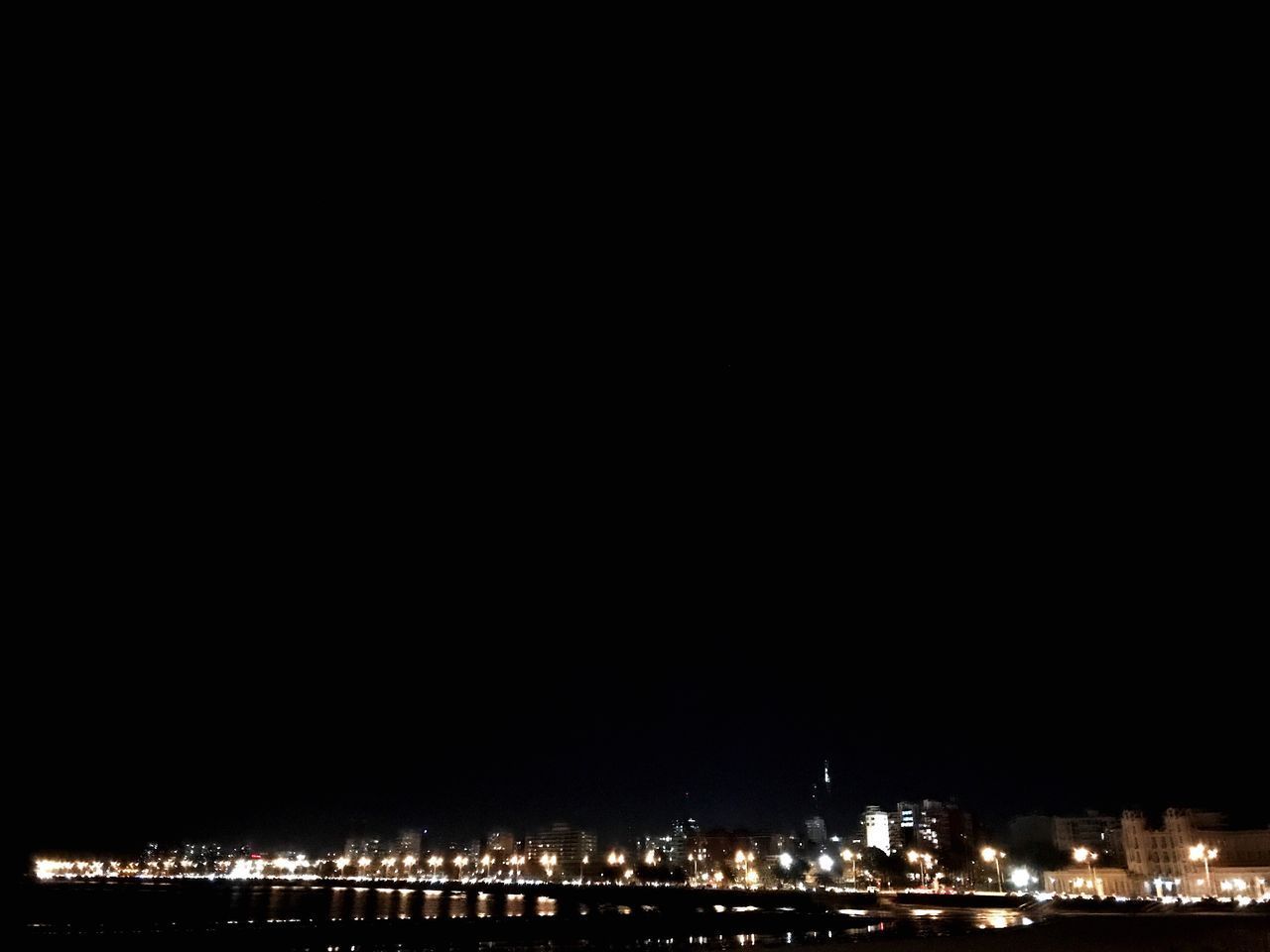 ILLUMINATED CITYSCAPE AT NIGHT