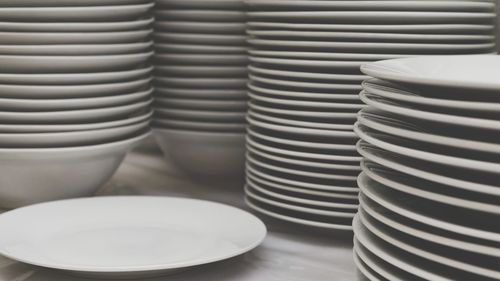 Stack of bowls and plates on table