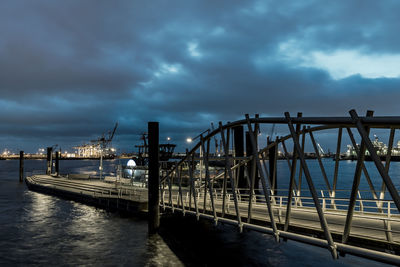 View of bridge against cloudy sky