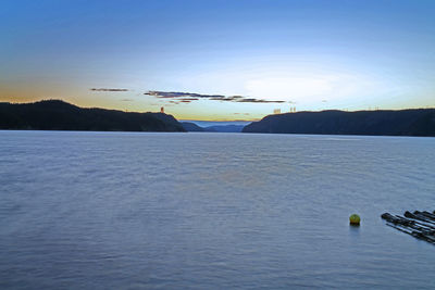 Scenic view of calm sea against blue sky