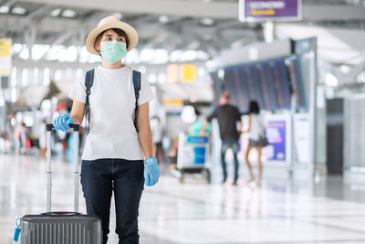 Woman with suitcase in airport