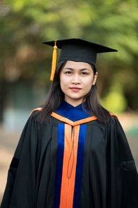 Portrait of smiling young woman standing outdoors