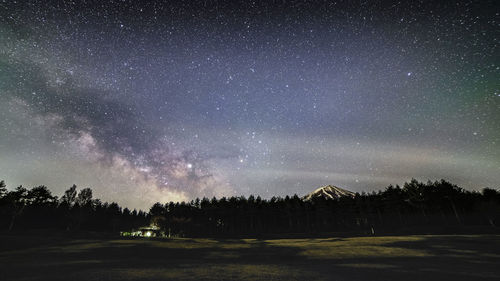 Scenic view of star field against sky at night