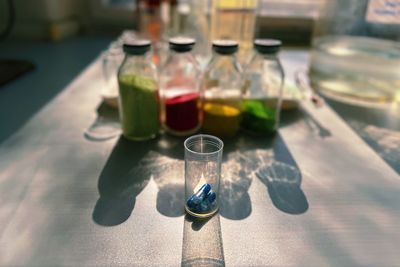 Close-up of pharmaceutical equipments bottles on table