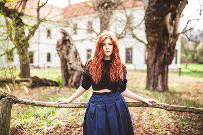 Beautiful redhead young woman smiling. outdoor portrait.