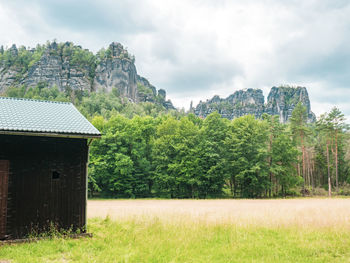 Panorama with group of rocks schrammsteine and falkenstein seen from valley bello, saxon switzerland