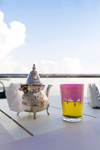 Moroccan tea with a tea cup against the clouds