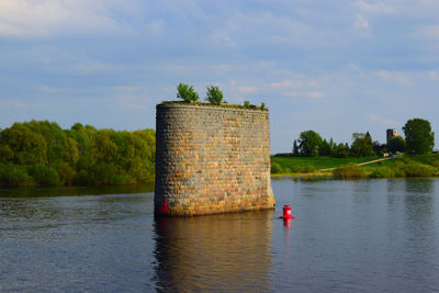 The pillars of the ancient unfinished bridge view from the river volkhov