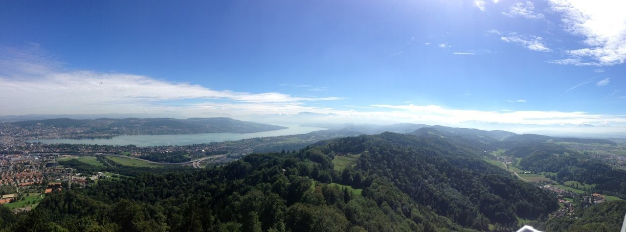 mountain, scenics, sky, tranquil scene, mountain range, landscape, beauty in nature, tranquility, tree, nature, blue, high angle view, cloud - sky, cloud, green color, idyllic, non-urban scene, day, aerial view, outdoors