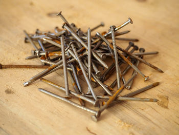 High angle view of metallic objects on table