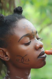 Close-up of teenage girl with make-up