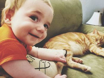 Portrait of cute baby girl with cat