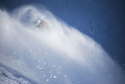 Aerial view of people on mountain during winter