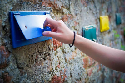 Close-up of hand opening mailbox