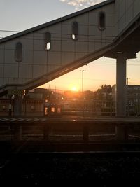 Railroad station platform at sunset