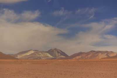 Scenic view of arid landscape against sky