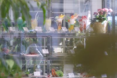 Reflection of flowers on window