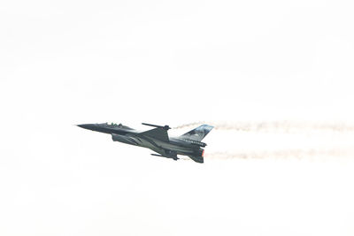 Low angle view of airplane flying in sky