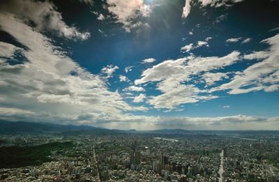 Scenic view of landscape against cloudy sky
