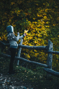 Rear view of man standing by tree
