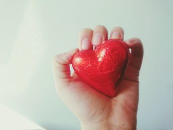 Cropped image of hand holding heart