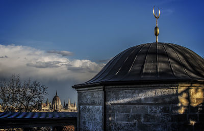 Low angle view of built structure against blue sky