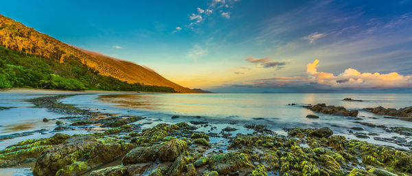 Scenic view of sea against sky at sunset