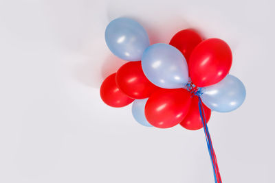 Colorful balloons stuck under the ceiling