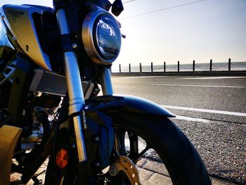 Close-up of bicycle on road in city