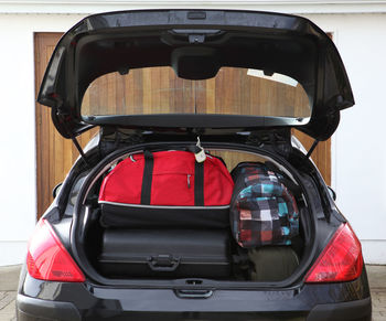 View of luggage in car trunk