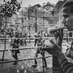 Side view of man drinking water