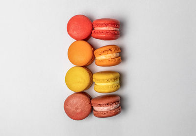 Directly above shot of macaroons against white background