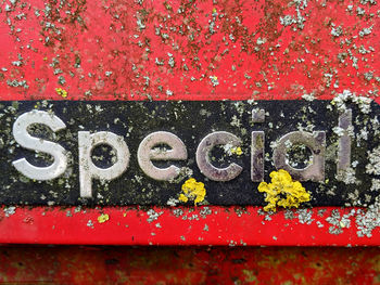 Close-up of text on red wall